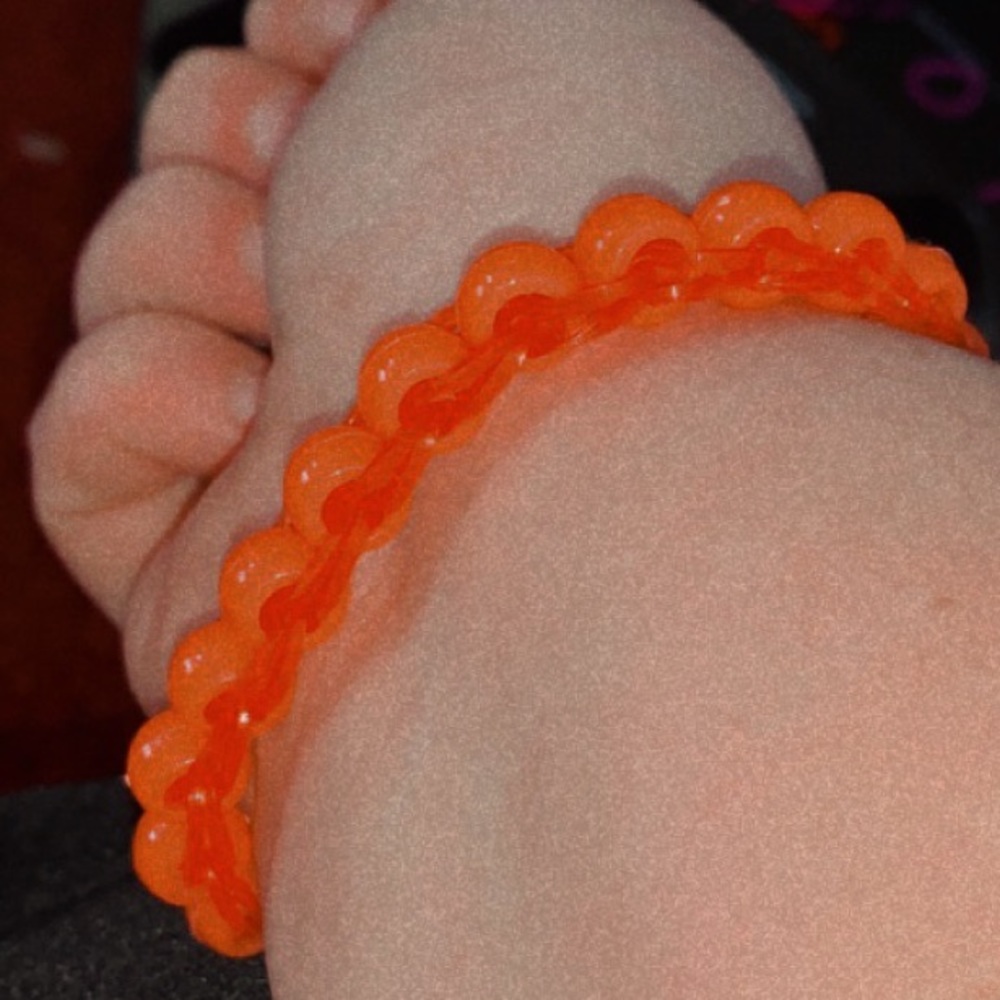 Red on red bracelets with beads and rubber bandz